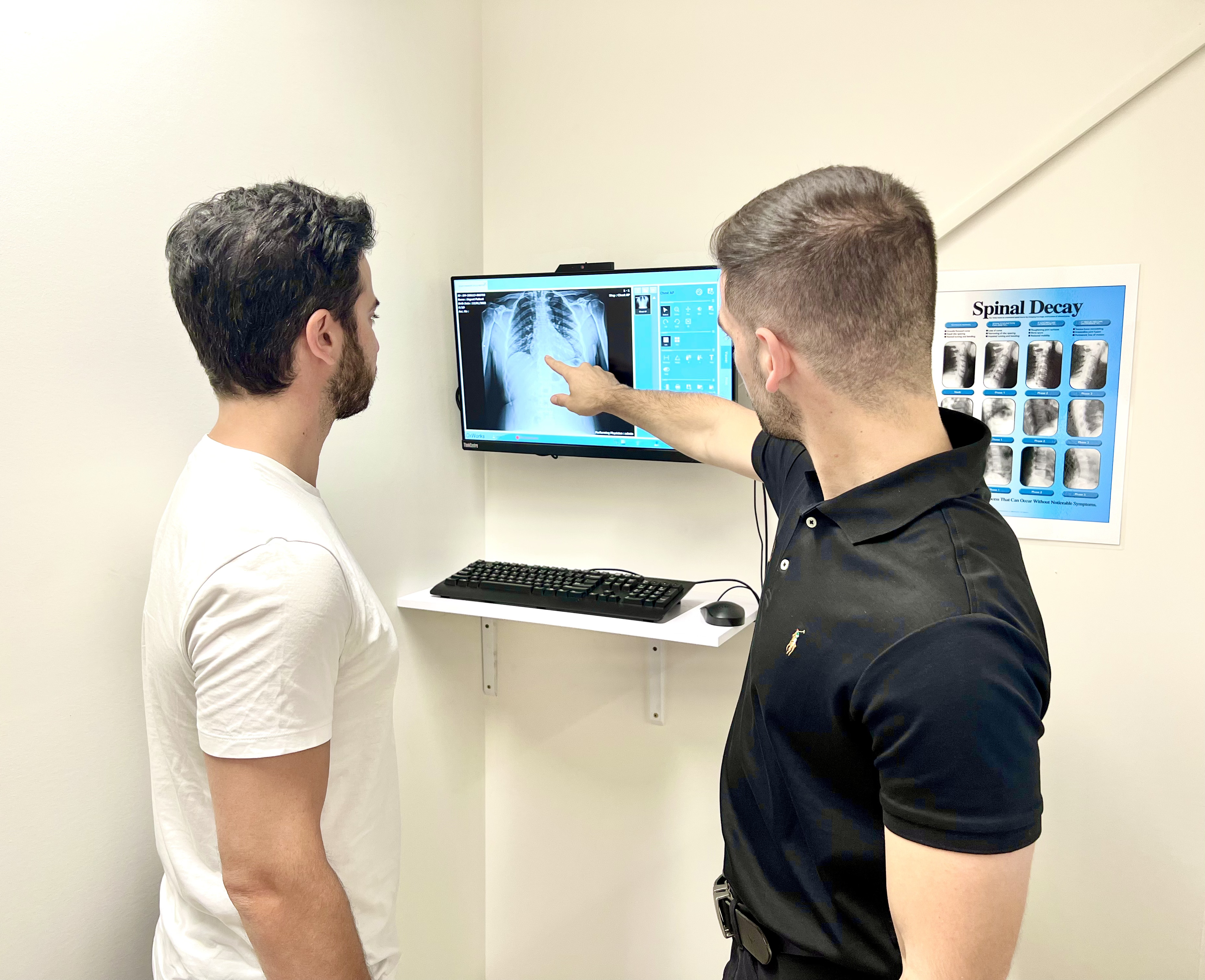 A warragul chiropractor showing the digital x-ray of his patient