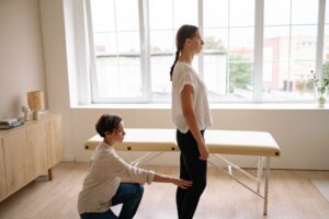 Teacher visiting a chiropractor Mickleham clinic for neck and back pain caused by driving long hours