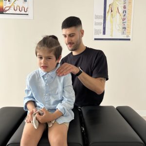 paediatric chiropractor doing adjustment to a kid
